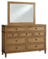 Sharlance Queen Upholstered Panel Bed with Mirrored Dresser