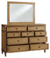Sharlance Queen Upholstered Panel Bed with Mirrored Dresser